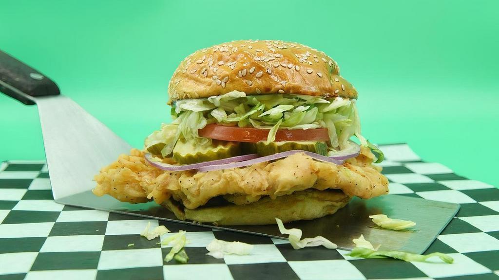 Pig Tenderloin · Indiana State Fair-style pork tenderloin, lettuce, tomato, pickle chips, red onion, and mayo