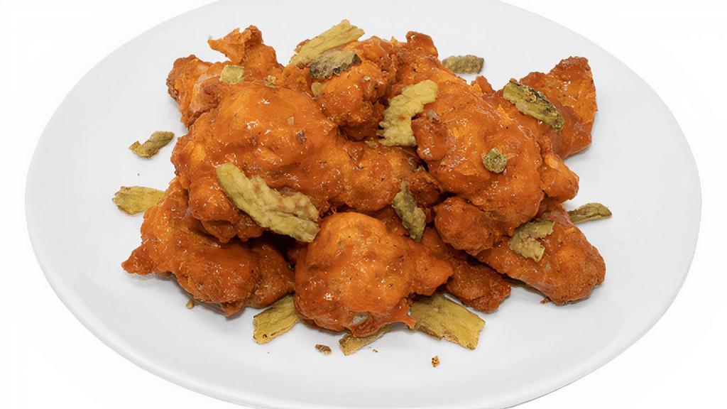 Buffalo Kick · 10 Wings tossed in Buffalo wing sauce and topped with crispy jalapenos