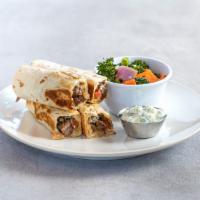 Steak Rollups · Grilled steak, swiss cheese, grilled mushrooms, and caramelized onions rolled in a warm tort...