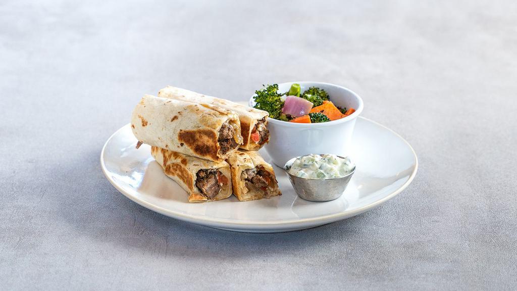 Steak Rollups · Grilled steak, swiss cheese, grilled mushrooms, and caramelized onions rolled in a warm tortilla. Comes with our salsa verde dipping sauce. Comes with Salsa Verde, Deep River Original Chips, and choice of apple slices or orange slices.