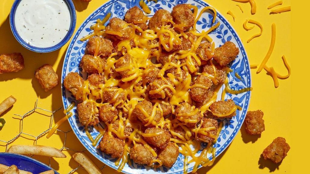 Cheese Tots · Say cheesy ~ with gooey, melted cheddar on top.