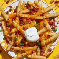 Loaded Fries · Get 'em loaded with cheddar cheese, sour cream, bacon and green onions.