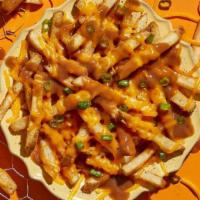 Country Fries · Make 'em country-fied with brown gravy, shredded cheddar & green onions.