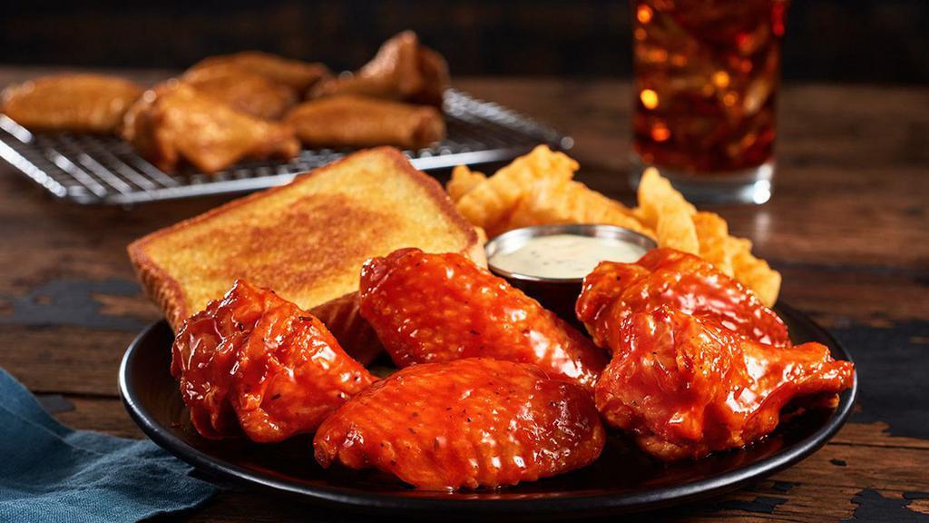 Traditional Wings Meal · Don't worry, no buffalo were harmed in the making of this meal. Traditional Wings, Texas Toast,  and Ranch Sauce, served with Crinkle Fries, and a small sized Coca-Cola Freestyle® drink, over 100 refreshing choices available in-store. (1060-1510 Cal)