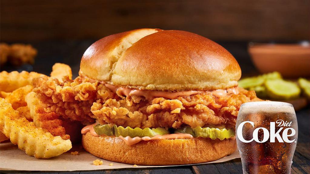 Zaxby'S ® Signature Sandwich · You know it’s a big deal when Zax Sauce® is involved. A big ol’ white breast meat fillet that’s been double hand-breaded in our new, extra crispy breading, dressed with our famous Zax Sauce® and three thick-cut pickle chips on a buttery, toasted, split-top potato bun. Best enjoyed as a meal with Crinkle Fries and a small sized Coca-Cola Freestyle® drink, over 100 refreshing choices available in-store. (1100-1460)