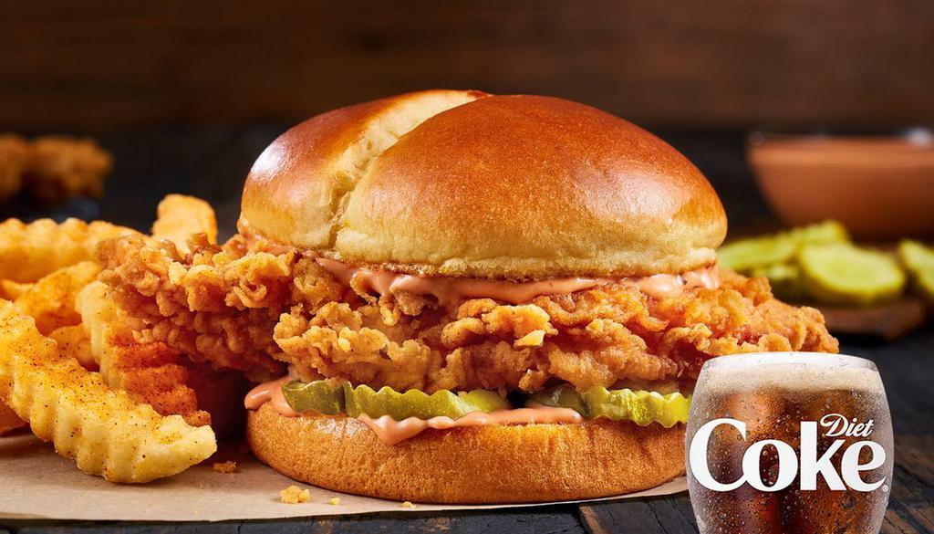 Zaxby'S ® Spicy Signature Sandwich · Did someone say spicy? Yep, it’s here. A whopping white breast meat fillet that’s been double hand-breaded in our new, extra crispy breading, dressed with our brand new Spicy Zax Sauce™? (I know right?!) and three thick-cut pickle chips on a buttery, toasted, split-top potato bun. Make it a meal with Crinkle Fries and a small sized Coca-Cola Freestyle® drink, over 100 refreshing choices available in-store. (1100-1450 Cal)