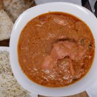 Butter Chicken · Boneless chicken barbecued and cooked in creamy tomato sauce. All entrée are served with bas...