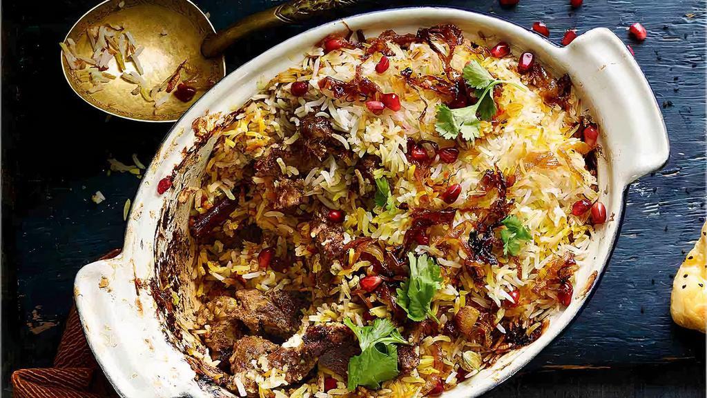 Lamb Biryani · Flavorful rice cooked with cubes of lamb marinated with Masala, saffron blended with exotic herbs and spices, served with raita on the side.