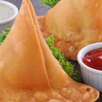 Samosa · Classic samosa stuffed with potatoes, peas, and spices. served with tamarind and mint sauces...