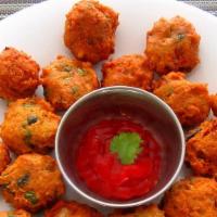 Daal Vada · Vada Made from mixed daal. Garnished with onions and spices. Served with Tamarind and mint s...