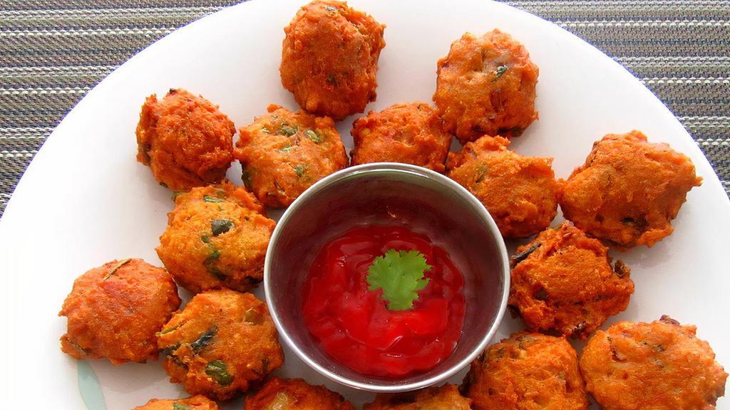 Daal Vada · Vada Made from mixed daal. Garnished with onions and spices. Served with Tamarind and mint sauces