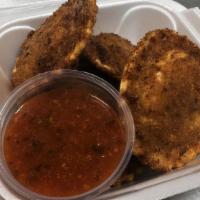 Fried Ravioli (8Pc) · Offering a crisp exterior with a piping hot inside that is oozing with savory flavor and cre...