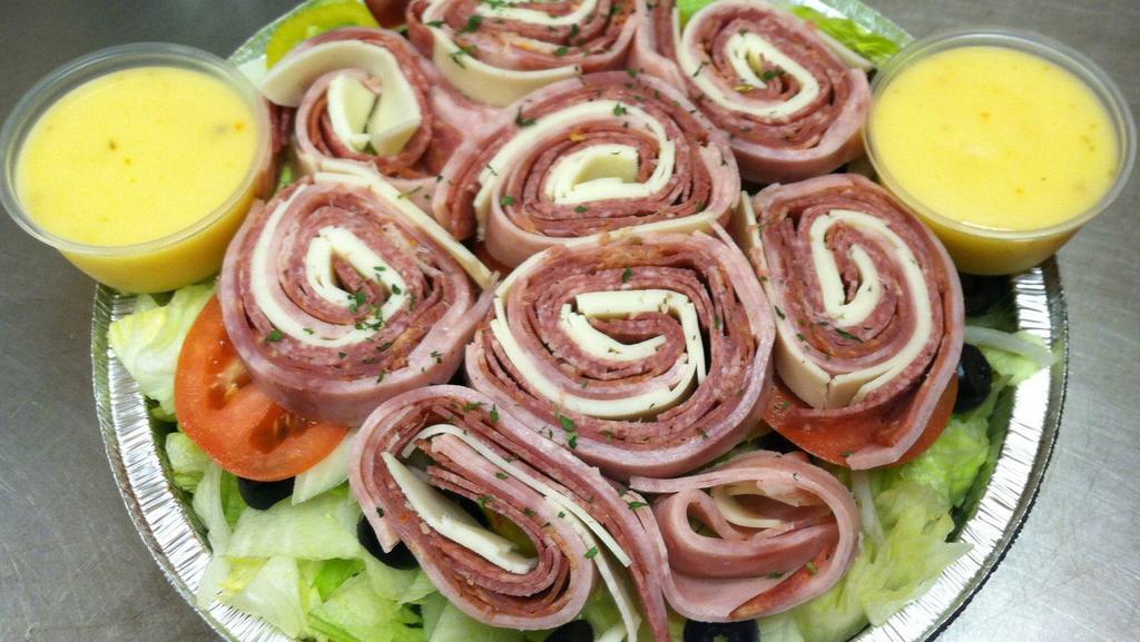 Antipasto Salad · Ham, capicola, salami, mozzarella cheese, lettuce, tomatoes, onions, cucumbers, black olives, pepperoncini, and onions.