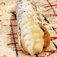 Fresh Cannoli · A flaky cannoli shell filled with creamy ricotta cheese flavored with tangy bits of orange.