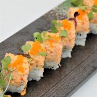 Monster Roll · Tempura shrimp and cucumber topped with snow crab salad, spicy mayonnaise, and masago.