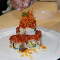 Dancing Lobster Roll · Fresh lobster, avocado, and mango, topped with spicy tuna, sweet chili sauce, and green mayo...