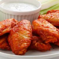 7 Wings · Flavor takes flight! Our slow smoked wings, tossed indoor choice of mild, hot, Cajun ranch o...