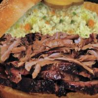Ultimate Pork Sandwich · We combine sliced bar-b-q pork and Carolina pulled pork, topped with cole slaw, our sweet sa...