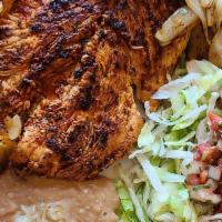Pollo Asado · Specially marinated Grilled Chicken Breast topped with grilled onions, served with Rice, Bea...