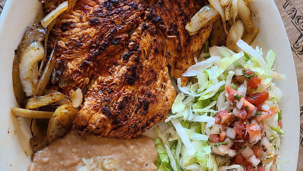 Pollo Asado · Specially marinated Grilled Chicken Breast topped with grilled onions, served with Rice, Beans and small salad