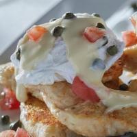Piccata Benedict · Chicken piccata and poached eggs on grilled focaccia. Topped with lemon caper hollandaise an...