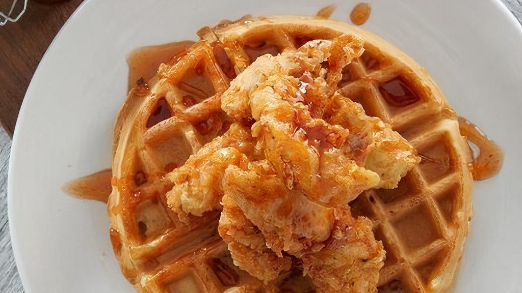 Chicken & Waffles · Crispy fried chicken tenders on a Belgian waffle, drizzled with house-made chipotle honey.