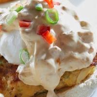 Crab Cake Benedict · Jumbo lump crab cakes on an English muffin, topped with poached eggs, andouille-infused holl...
