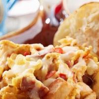 Big Easy Scrambler Platter · Scrambled eggs, Louisiana crawfish tails, andouille, onions, red peppers and fresh country p...