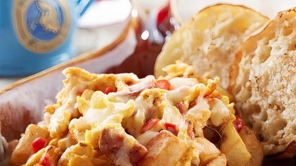 Big Easy Scrambler · Scrambled eggs, Louisiana crawfish tails, andouille, onions, red peppers and fresh country potatoes with Jack cheese. Served with an English muffin.