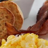 Traditional Day Starter · Two eggs any style with your choice of baked bacon, house-made sausage patties, andouille sa...