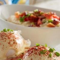 Eggs Benedict · Grilled breakfast ham on an English muffin, topped with poached eggs, hollandaise and green ...
