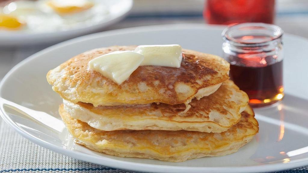 Buttermilk Pancakes · Three house-recipe buttermilk cakes.