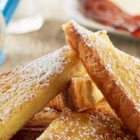 Classic French Toast - Vegetarian Option · Thick-sliced bread battered and grilled, topped with powdered sugar. Served with two eggs an...