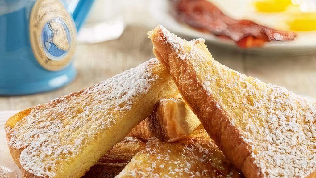 Classic French Toast - Vegetarian Option · Thick-sliced bread battered and grilled, topped with powdered sugar. Served with two eggs any style and your choice of grits, fresh country potatoes, fresh seasonal fruit or tomatoes as a substitution for the bacon sausage or ham.