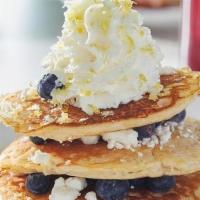 Lemon Blueberry Goat Cheese Pancakes  · Three house-recipe cakes with fresh blueberries and goat cheese, topped with lemon zest and ...