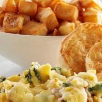 Sunrise Spinach Scrambler - Gluten Friendly · Scrambled eggs filled with fresh spinach, bacon and onions, topped with Jack cheese. Substit...