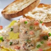Lobster & Brie Omelette · Cream cheese-filled omelette topped with Brie cheese and champagne butter sauce sautéed lobs...