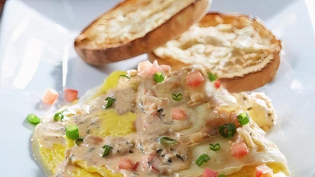 Lobster & Brie Omelette · Cream cheese-filled omelette topped with Brie cheese and champagne butter sauce sautéed lobster meat, tomatoes and green onions. Served with an English muffin.