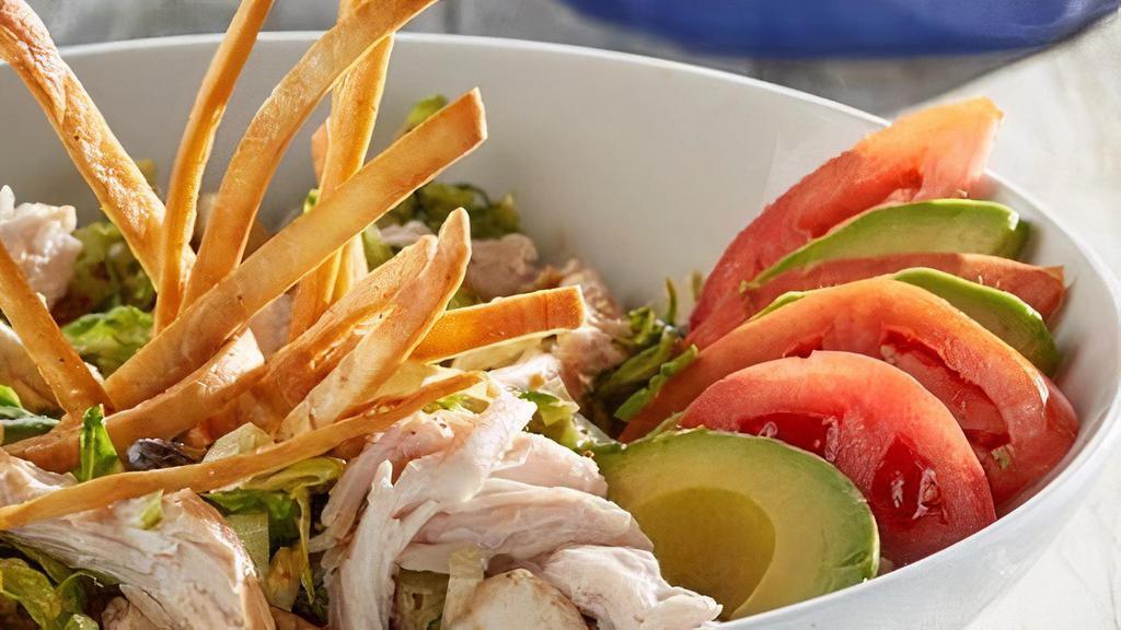 Southwest Chop Salad · Romaine, spinach, mushrooms, red onion, black beans, chopped bacon and turkey tossed in a chipotle ranch.  Served with crispy tortilla strips, avocado and tomato slices.  Substitute chicken at no additional cost.