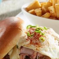 Benedict Burger · Hand-pressed beef patty, grilled ham, over-medium fried egg, hollandaise and green onions on...