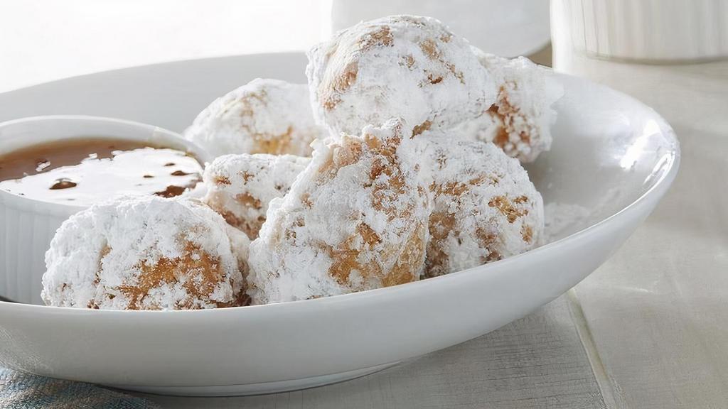Biscuit Beignets · Southern-style beignets with powdered sugar and honey marmalade.