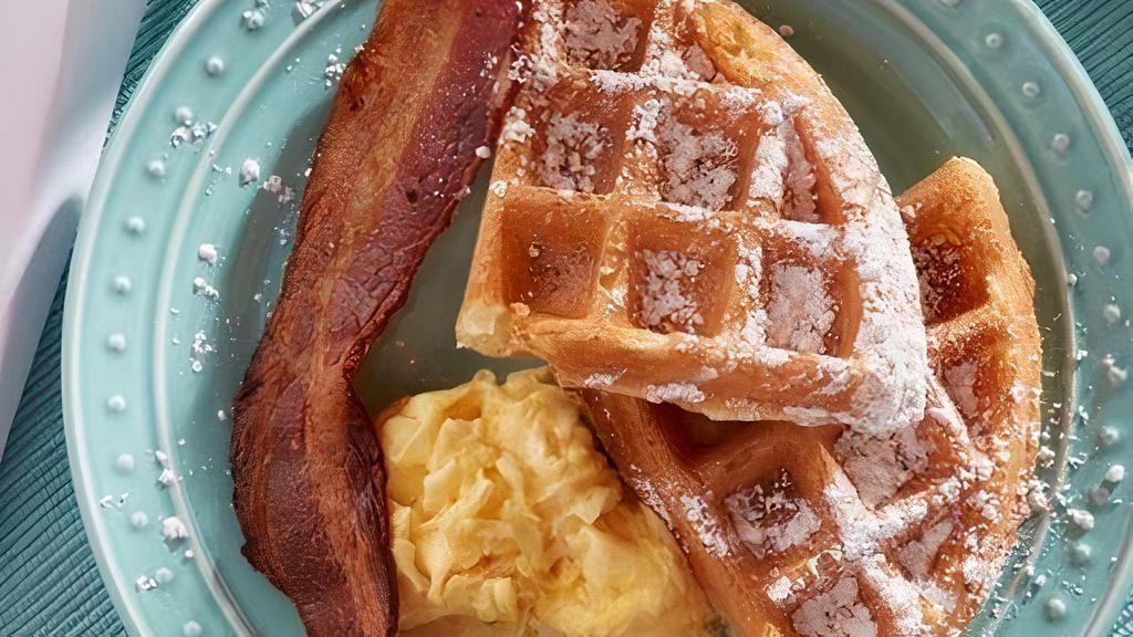 Kids' Waffle Sampler · Kid-sized waffle topped with powdered sugar. Served with scrambled egg and baked bacon.