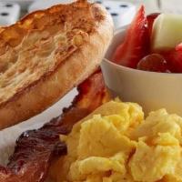 Kids' Little Rooster · Scrambled egg, fresh seasonal fruit, English muffin and baked bacon.