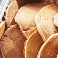 Buttermilk Pancake Platter · 20 house-recipe buttermilk cakes. Served with butter and syrup. (Serves 10)