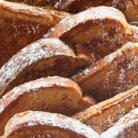 Classic French Toast Platter · 20 pieces of thick-sliced bread battered and grilled, topped with powdered sugar. Served wit...
