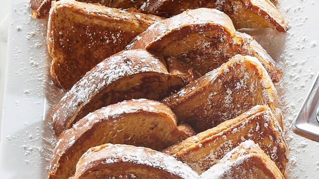 Classic French Toast Platter · 20 pieces of thick-sliced bread battered and grilled, topped with powdered sugar. Served with butter and syrup. (Serves 10)