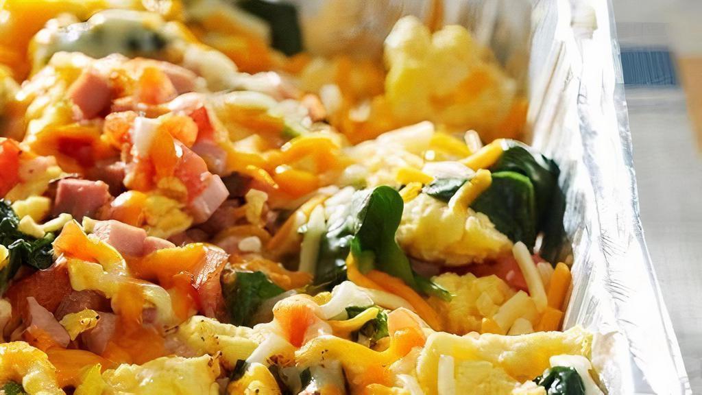 Make It A Scrambler · Scrambled eggs topped with Cheddar Jack cheese. Choose any 3 of the following additions: spinach, mushrooms, red peppers, onions, tomatoes, bacon, sausage, maple apple chicken sausage, ham or chorizo. (Serves 10)