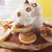 Bourbon Street Pancakes - Vegetarian Option · Two house-recipe cakes topped bananas, pecans, rum butter drizzle sauce and whipped cream. S...