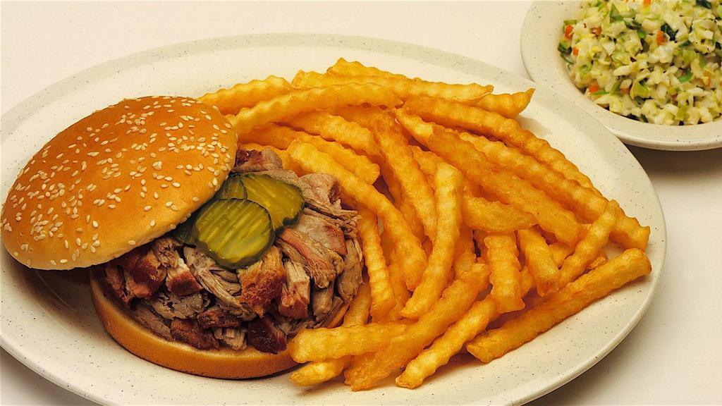Texas Beef Brisket · Served on a bun with pickles and red onion. Served with your choice of one creamy coleslaw, french fries, mashed potatoes and gravy, baked or sweet potato, and bbq beans or country vegetables.