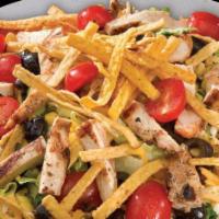 Southwest Salad · Tex Mex inspired salad featuring freshly chopped romaine, mesquite-grilled chicken breast, c...